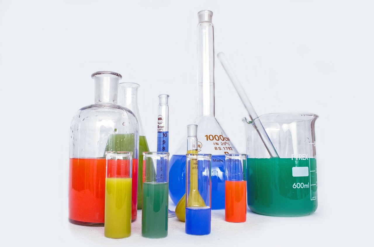 chemistry glassware with colored solutions 